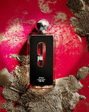 9 PM by Afnan Perfumes - Eau De Parfum Vaporisateur bottle on a luxurious red and gold textured background, highlighting the product's sleek design and metallic cap.