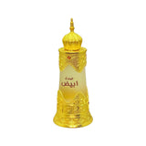 The image features a perfume bottle with a design that draws inspiration from Middle Eastern art and architecture. The bottle has a white-to-gold gradient with a predominantly frosted white upper half that transitions to a clear lower half. It is adorned with ornate gold embellishments that cover the mid-section and base, including intricate arabesques and geometric patterns typical of Islamic art. A distinctive feature of the bottle is the elaborate gold cap, which resembles the dome of a mosque.