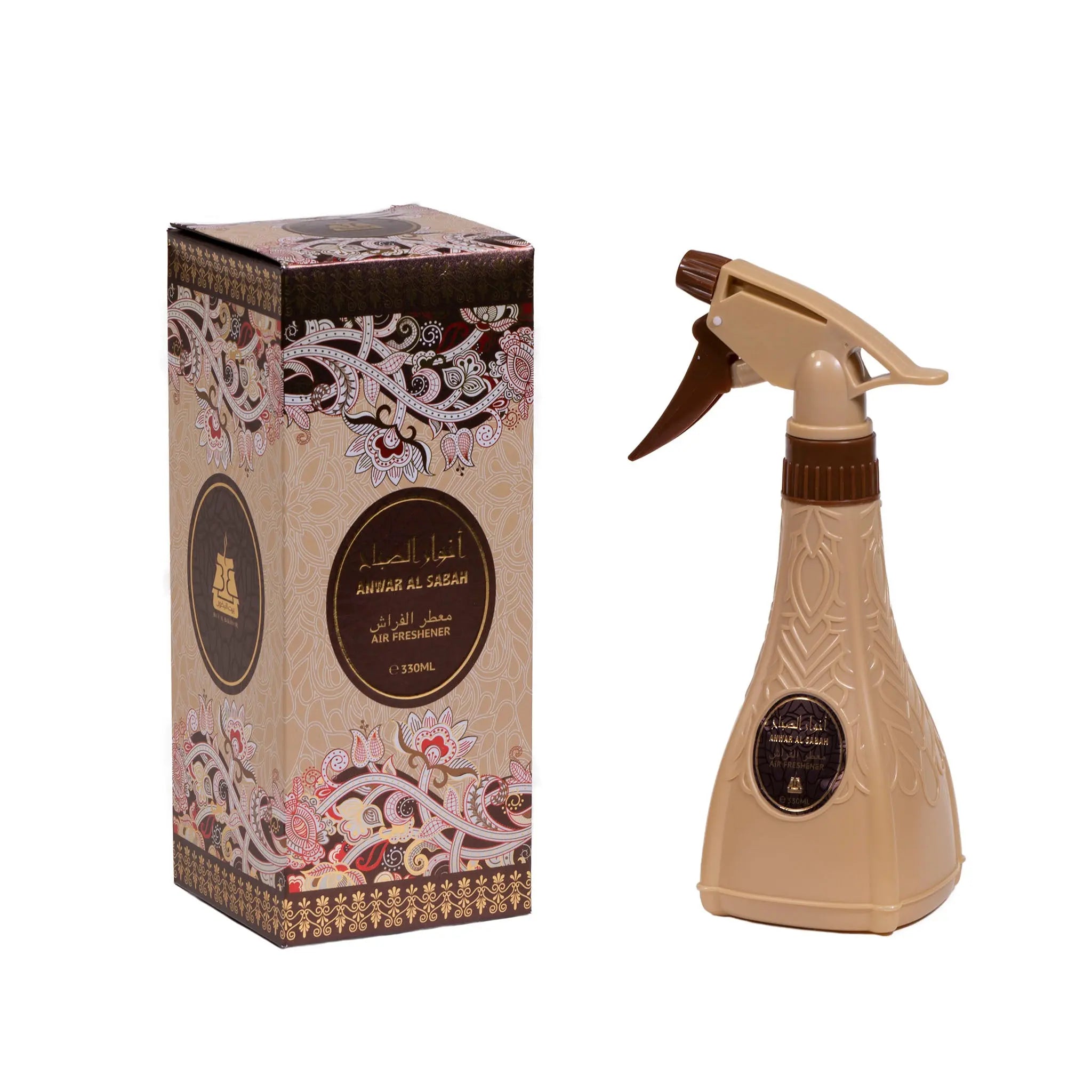 The image features a product set including an air freshener spray bottle and its packaging box. The spray bottle is a beige color with a dark brown, ornate design and a label that matches the box's aesthetic, featuring Arabic calligraphy and an English translation, presumably the name of the scent "ANWAR AL SABAH." The trigger of the spray is a dark brown color, complementing the overall design. Both the bottle and the box share a luxurious, traditional Middle Eastern design aesthetic.