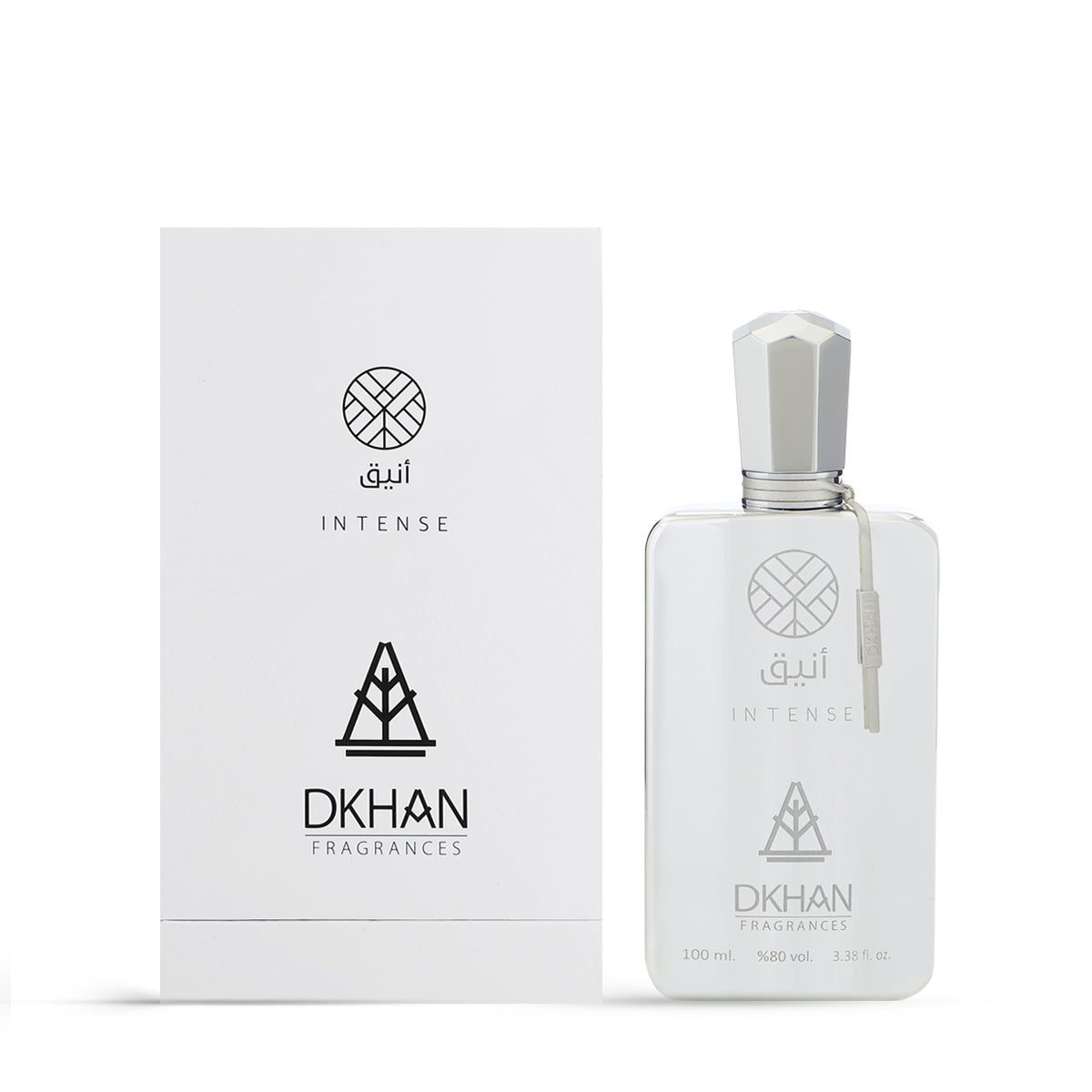 This image presents a sophisticated white perfume bottle alongside its packaging. The bottle, labeled Aneeq Intense, holds 100 ml or 3.38 fl. oz. and features a 98% volume concentration. Its design is minimalistic with clean lines, a geometric faceted cap, and a transparent label showcasing the DKHAN Fragrances logo—a heart within a diamond. A small, beige tag hangs from the bottle's neck. 