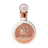 The image features a round, flat white perfume bottle with a rose gold cap and intricate rose gold detailing on the front. The central design is an ornate butterfly, surrounded by a braided border, with the name "Fakhar Lattafa" written below. The cap has the brand's logo "Lattafa" in stylized Arabic calligraphy. The aesthetic suggests a feminine and elegant fragrance product.