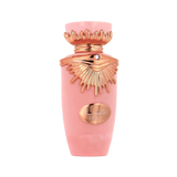 The image is a product shot of a pink bottle with metallic rose gold accents. The bottle has a distinctive shape with a flared neck and a decorative element that resembles wings around the cap, which might indicate that it is a fragrance bottle. The center of the bottle features a metallic rose gold oval-shaped plaque with an emblem or logo. The cap also has a small, circular detail that could be a gemstone, adding to the luxurious appearance of the bottle.