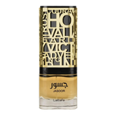 The image shows a bottle of perfume. The bottle has a clear bottom filled with yellow-amber colored liquid, presumably the fragrance. It features a detailed, ornate, gold-colored metallic overlay with cut-out letters and designs, and a black band towards the top, under the cap. The name "JASOOR" is prominently displayed in the middle of the bottle, with the brand "Lattafa" written at the bottom. The overall design suggests a luxurious and perhaps Middle Eastern-inspired aesthetic.
