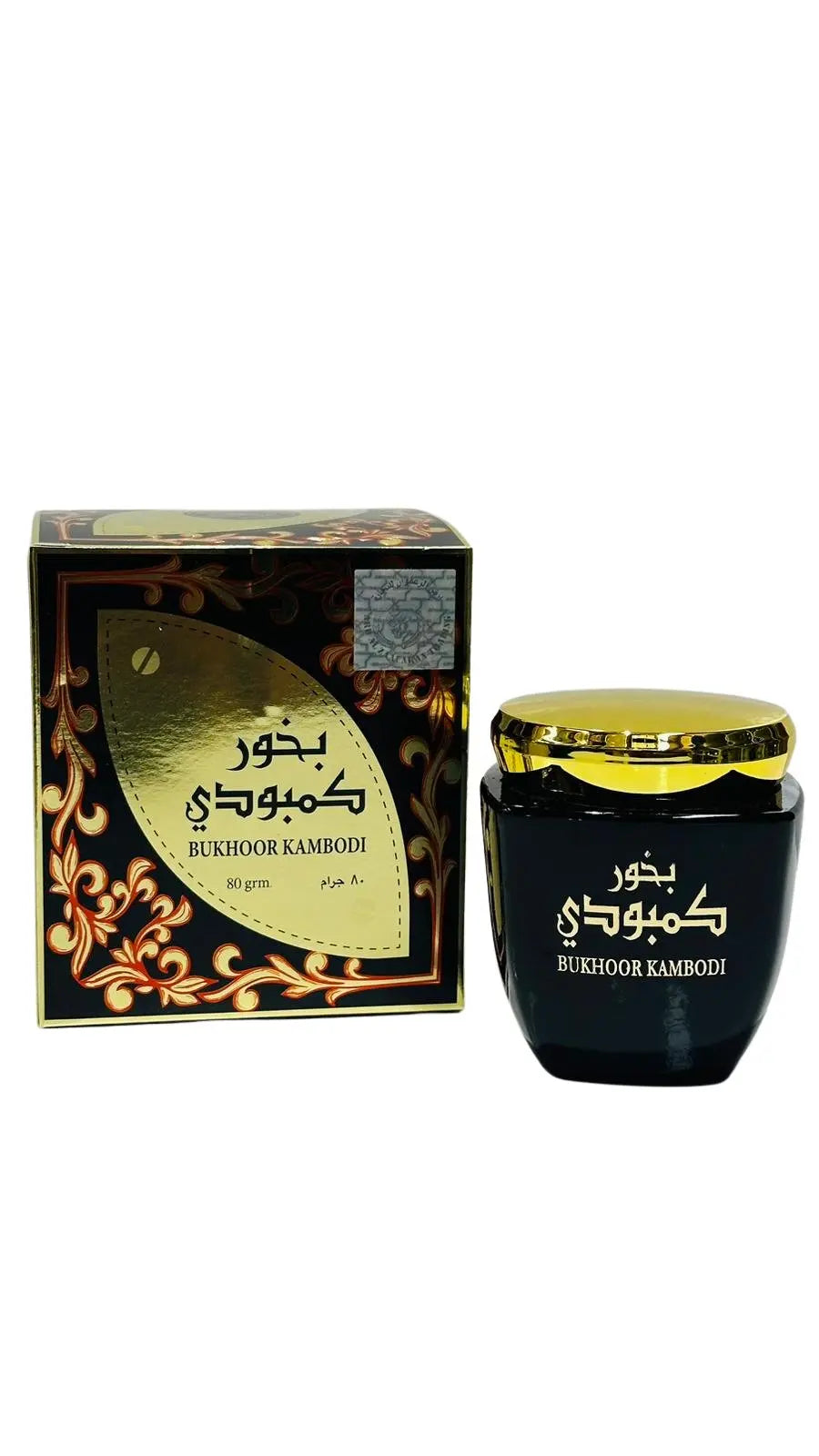 The image features a set of Bukhoor Kambodi by Ard Al Zaafaran, including a box and a container. The box has a black background with ornate gold and red swirl patterns framing a gold leaf-shaped design in the center, within which the product name "BUKHOOR KAMBODI" is inscribed in both Arabic and English script. The weight is stated as "80 grm." Next to the box is the bakhoor container with a glossy black finish and a metallic gold cap.