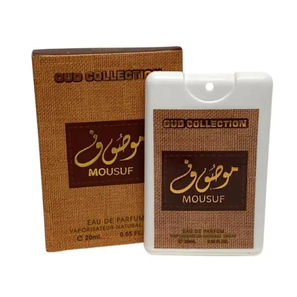 The image shows a small, flat, white bottle of "OUD COLLECTION MOUSUF" eau de parfum next to its brown packaging box. The bottle has a square shape with rounded edges and a brown label with gold and white text. It contains 20ml or 0.65 fl oz of the perfume. The box has a textured appearance with a similar color scheme and design as the bottle's label, displaying the product name and size prominently. The design suggests a luxurious and exotic fragrance product.