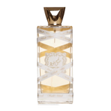 The image displays a rectangular perfume bottle with a golden-yellow liquid inside. The cap is a geometric, faceted gold design. A white ribbon with the text "Musk Mood" in a repeating pattern wraps around the bottle. Additionally, a decorative gold label with elaborate borders and an emblem is affixed to the center of the bottle.