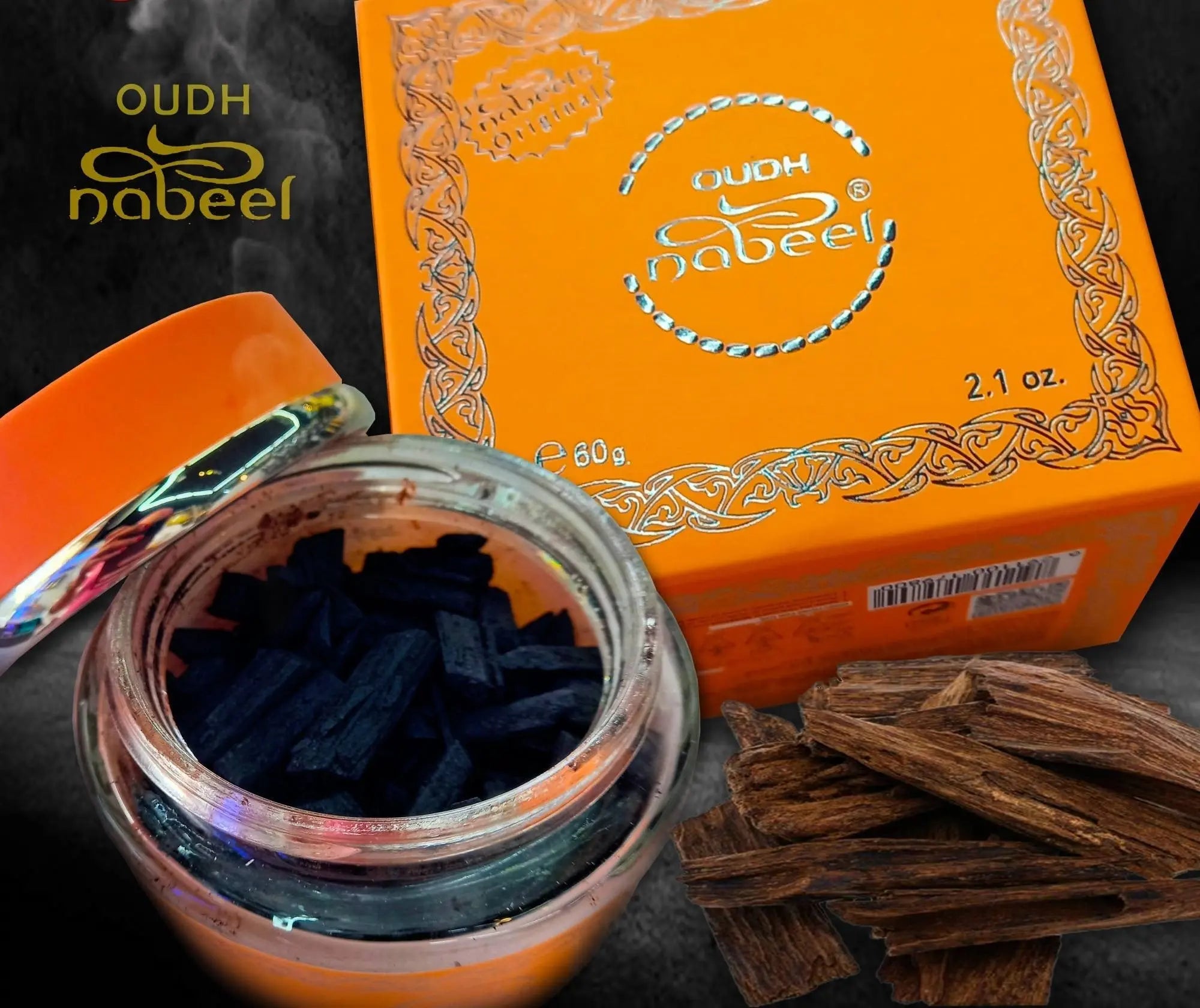 The image is a dynamic presentation of Nabeel Oudh products. It shows a glass jar opened to reveal dark oudh chips inside, with a metallic rainbow-colored lid reflecting light. In the background, there is an orange box with white decorative lace-like patterns and the "OUDH Nabeel" branding in white. There are also raw pieces of oudh wood scattered in the foreground, suggesting the natural source of the chips.