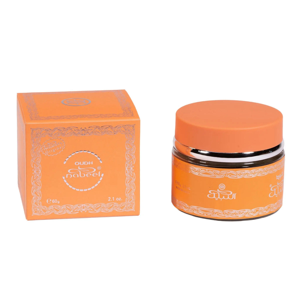he image shows a product from Nabeel Perfumes, specifically their Oudh variant. On the left is a square orange box with white lace pattern borders and the product information in white text that reads "OUDH Nabeel." On the right is a round jar with an orange lid and a black band with the Nabeel logo in white Arabic and English text. The jar likely contains the oudh product, and both items are set against a plain white background that emphasizes the product's bright packaging and branding details.