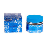 The image shows a product called "OUDH Khawatir" by Nabeel, featuring a bright blue and silver box with intricate, swirling floral patterns, and a clear glass jar with a solid blue lid. Both the jar and the box display the name "OUDH Khawatir" in white lettering with an ornamental design that carries an Arabic aesthetic. The label also includes the weight "60g, 2.1 oz." and "MADE IN UAE" indicating its origin.