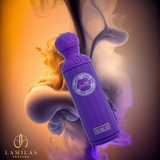 Purple Gissah Voilà perfume bottle floating with swirling orange and purple smoke.