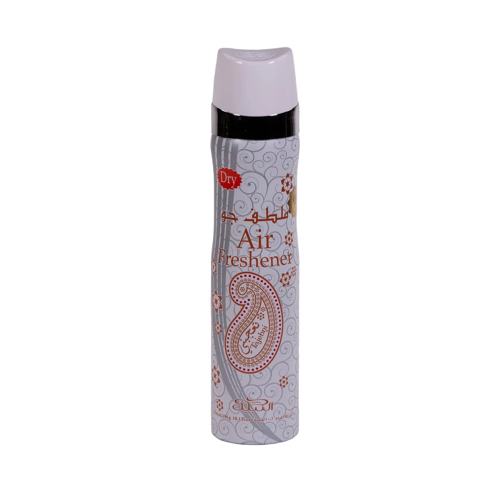 The image shows a "Tajebni" air freshener can. The body of the can is white with a grey paisley design and red floral patterns. It has "Air Freshener" written in both Arabic and English, with a "Dry" label at the top. The cap is white, matching the can's body. The brand "nabeel" is printed at the bottom in a decorative script. The overall design of the can gives off a clean and possibly floral scent impression.