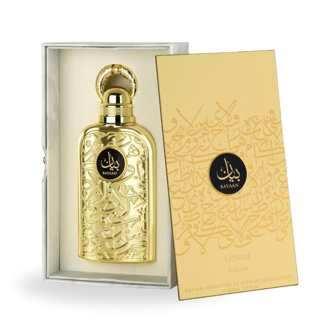 The image shows an elegant perfume set that includes a bottle and its box. The bottle is placed inside a silver-grey box with a satin-like cushioning, highlighting its luxurious design.  The box also has the "BAYAAN" branding and the name "Lattafa" printed on it, along with the description "Natural Spray Eau de Parfum" and the quantity information. The background is plain, accentuating the product's premium appearance.