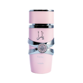 This image depicts a cylindrical, pale pink perfume bottle with the name "YARA" from the brand Lattafa. The bottle has a unique stacked design with silver bands wrapping around it, giving the appearance of three separate sections. The upper and lower sections are matte pink, while the middle section is glossy black, providing a striking contrast. A silver emblem with intricate detailing is centered on the middle band. The Arabic script, likely the name "YARA," is printed in black on the upper pink section.