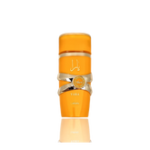 This image features a bright orange cylindrical perfume bottle with the name "YARA" from the brand Lattafa. The design is distinguished by a gold ribbon-like band wrapped around the center, with a circular emblem featuring text that may denote "EAU DE PARFUM NATURAL SPRAY". The Arabic script for "YARA" is placed above the gold band. The bottle has a glossy finish and is presented against a gradient background that fades from white at the top to a light reflection of the bottle at the base.