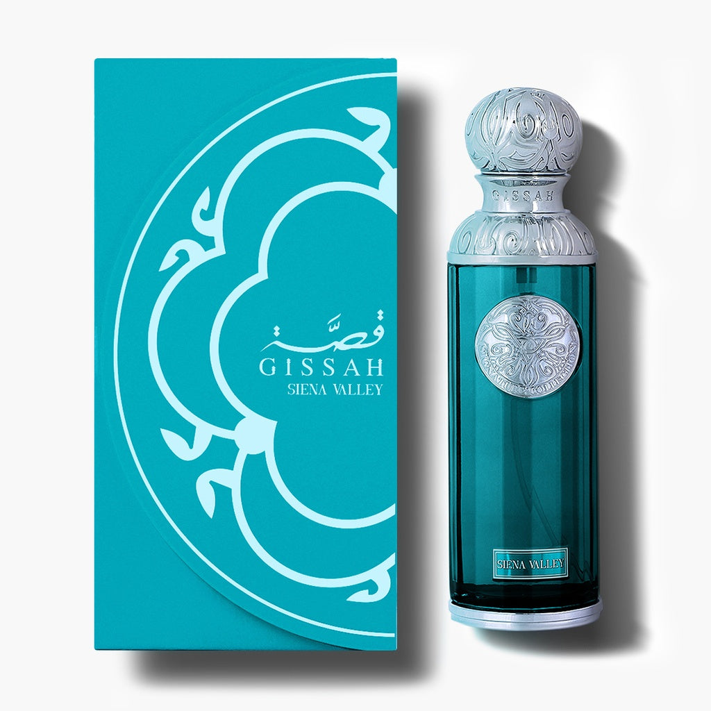 Gissah Siena Valley turquoise perfume bottle with silver cap beside matching teal box on white.
