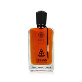 The image shows a rectangular glass perfume bottle with a black cap, filled with an orange-colored liquid. The bottle has several labels: the top one includes a circular logo with the text "KEHL" and a smaller text below it reads "INTENSE". In the center, there's a large stylized emblem with the text "DKHAN FRAGRANCES" beneath it.