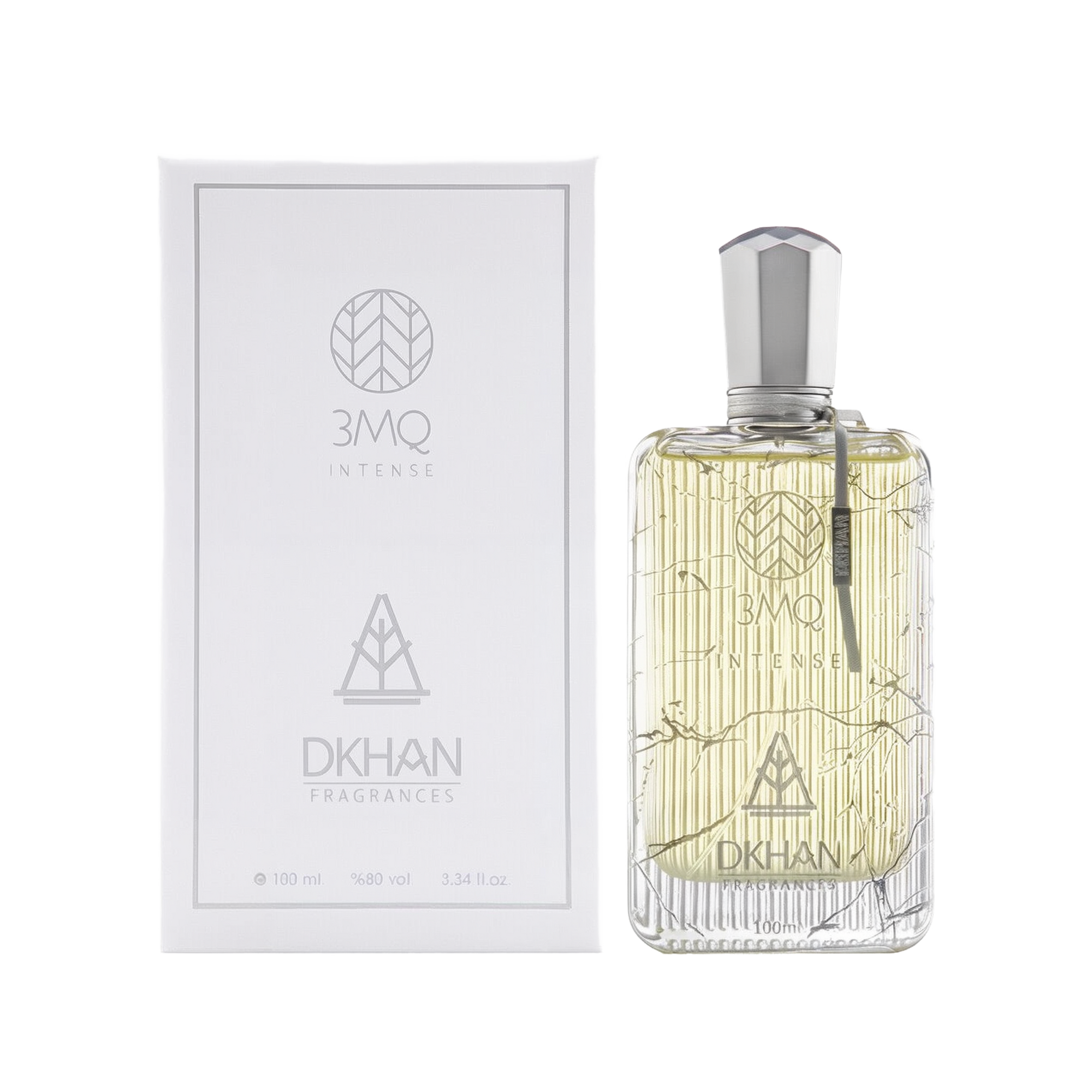 The image shows a luxurious clear glass perfume bottle with a silver cap, engraved with intricate, geometric patterns and the branding "3MQ INTENSE" in the center. To the left, the white packaging box echoes the bottle's design, with "3MQ INTENSE" and "DKHAN FRAGRANCES" emblems in a sleek, modern font. Both the bottle and box indicate the volume "100 ml", alcohol content "98% vol", and size "3.34 fl. oz." 