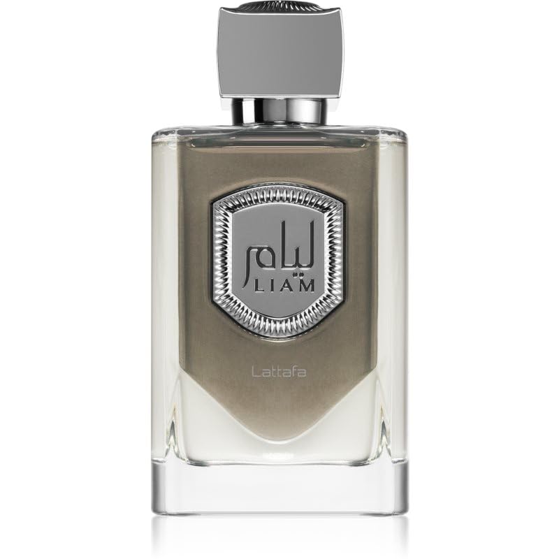 The image shows a rectangular glass perfume bottle with a metallic silver label in the center. The label has the text "LIAM" in uppercase letters and Arabic script above it. Below the label, the word "Lattafa" is printed, indicating the brand of the perfume. The bottle has a translucent appearance with a reflective silver cap on top. The design is modern and sleek, suggesting a luxurious product.