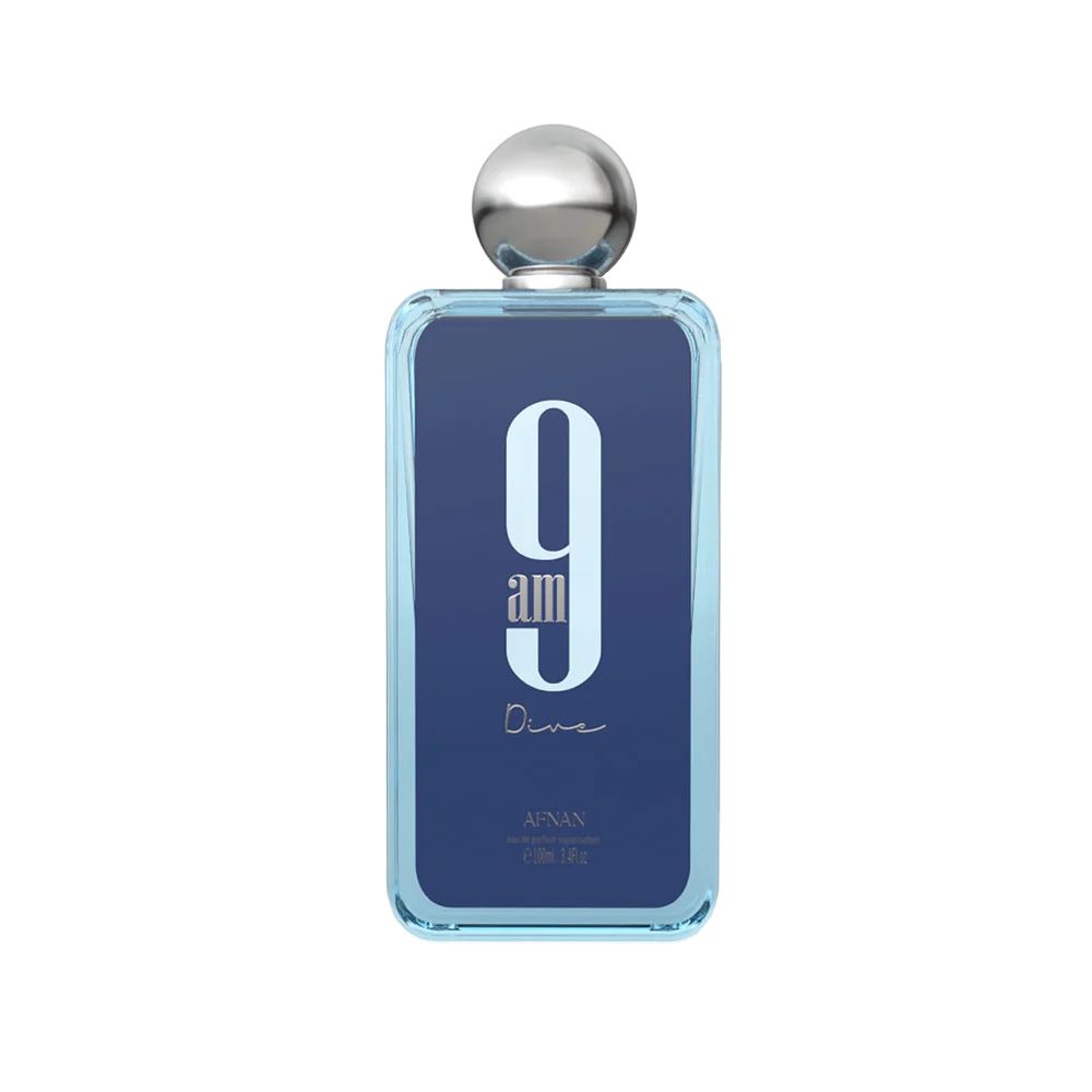 The image shows a rectangular glass perfume bottle with rounded edges. The bottle has a transparent blue tint with a large white number "9" and the text "am" below it in a lighter shade of blue. Beneath this, the word "Dine" is written in a cursive, handwritten style. The cap of the bottle is a polished silver sphere. The brand "AFNAN" is written in small letters at the bottom of the bottle.
