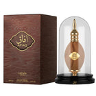 The image features a perfume product display consisting of a bottle and its packaging. The bottle of AFAQ Latifa perfume, resembling wood grain with golden accents, is placed within a clear glass dome on a black pedestal. The pedestal has the brand name "
