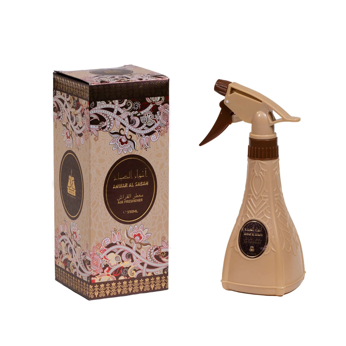 The image features a product set including an air freshener spray bottle and its packaging box. The spray bottle is a beige color with a dark brown, ornate design and a label that matches the box's aesthetic, featuring Arabic calligraphy and an English translation, presumably the name of the scent "ANWAR AL SABAH." The trigger of the spray is a dark brown color, complementing the overall design. Both the bottle and the box share a luxurious, traditional Middle Eastern design aesthetic.