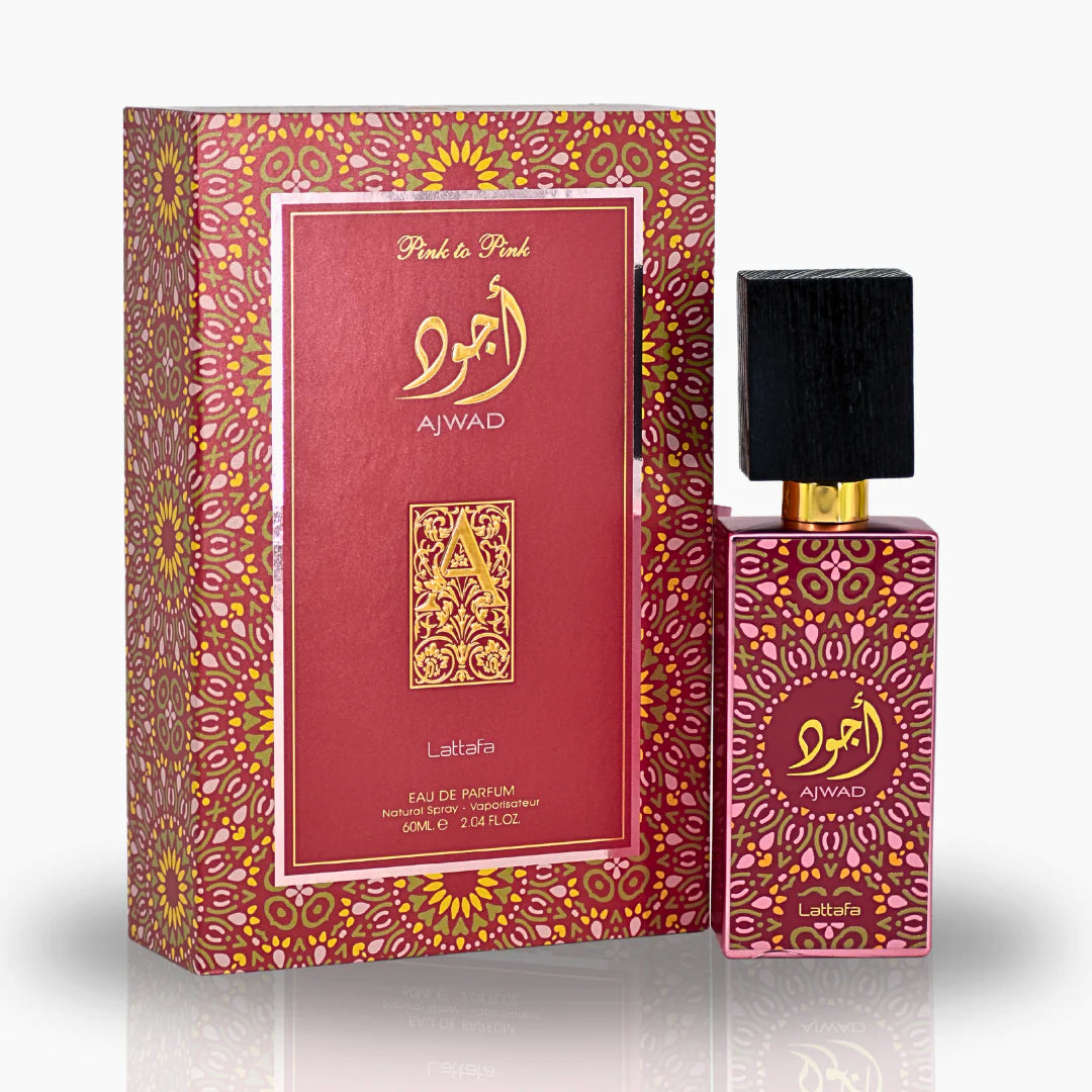 Image of a pink perfume bottle with a black textured cap, alongside its box. The bottle features gold detailing and Arabic calligraphy with the word 'AJWAD' on the label. The box repeats the pattern from the bottle in a wrap-around style with a golden front panel that includes the text 'Pink to Pink', 'AJWAD', a decorative gold emblem, 'Lattafa', and 'Eau de Parfum 60ml e 2.04 FL.OZ'. Both items have a reflective finish against a white background.