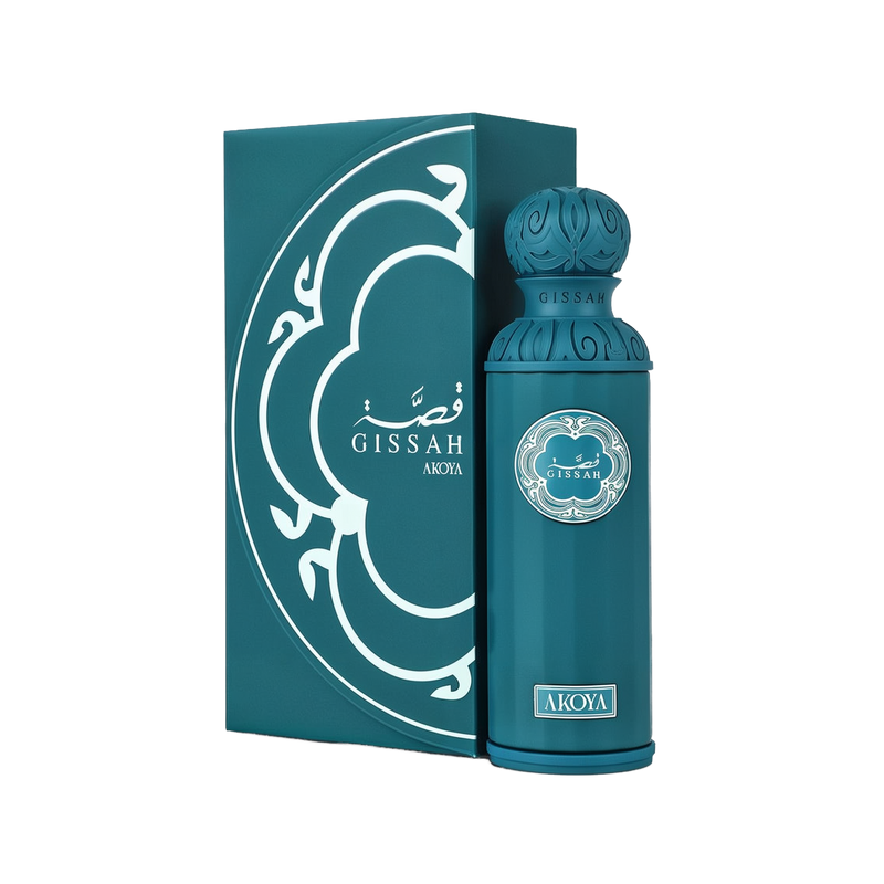 A product image showing the Gissah “Akoya” perfume: a tall, rectangular teal gift box decorated with a white, Arabic-inspired arabesque pattern and the brand name “Gissah” (in Arabic and English) with “Akoya” printed beneath, paired with a matching cylindrical teal perfume bottle featuring an intricately carved rounded cap.
