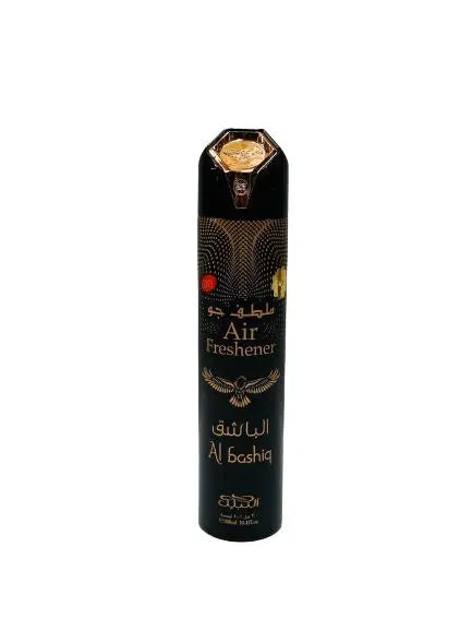 The image shows an air freshener can named "Al Bashiq." The can is tall and black with a decorative golden and brown pattern that includes the silhouette of a bird. It features gold text in Arabic and English, with "Air Freshener" prominently displayed in the center. The top of the can has a golden cap with a diamond-shaped emblem. The design elements suggest an exotic or luxurious scent, and the can is presented against a plain white background to emphasize the product's details.