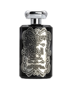 The image features a black perfume bottle with a detailed silver embossed design on the front. The central design includes Arabic calligraphy that reads 'AL IBDAA', likely the name of the fragrance. Below the calligraphy, in smaller English text, it states 'EAU DE PARFUM', 'VAPORISATEUR NATURAL SPRAY', '100ml', '80% VOL', and '3.4 FL.OZ', which describe the product type, dispensing method, volume, alcohol content, and fluid ounces, respectively. 