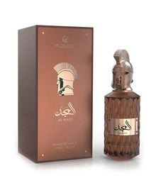 A product shot showing Le Falcone Niche Collection’s “Al Majd” perfume against a white background: on the left, a tall matte-brown rectangular gift box with a glossy copper front panel featuring the Le Falcone logo, a stylized profile of a warrior’s helmet, Arabic calligraphy, and the words “Al Majd” (Extrait de Parfum, 85?ml / 2.8?fl?oz). On the right sits the matching perfume bottle — an amber, diamond-cut glass cylinder topped by a sculpted bronze wlarrior-helmet cap.