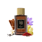 The image features a dark amber glass perfume bottle with a gold cap, labeled "Musk Kashmir" in both Arabic calligraphy and English text, indicating it's from the brand Ibraheem Al Qurashi. The bottle is presented against a white background, flanked by cinnamon sticks to the left, a purple flower (possibly a saffron crocus), vanilla beans, and a white flower (likely an orchid) in front, with some yellow crystalline substance (perhaps amber) and red saffron threads to the right.