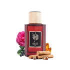 The image depicts a dark red glass perfume bottle with a gold cap, labeled with Arabic calligraphy and English text "Sandalwood" indicating the fragrance. It's from the brand Ibraheem Al Qurashi. The bottle is surrounded by a dark pink rose, some blueberries to the left, and sandalwood sticks in the foreground, suggesting the notes of the fragrance.