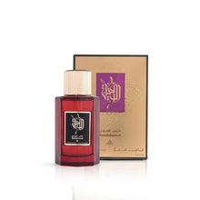 The image showcases a dark red glass perfume bottle with a gold cap, in front of its packaging. The bottle has a label with Arabic calligraphy and English text below it that reads "Sandalwood," indicating the scent. The brand is Ibraheem Al Qurashi. Behind the bottle is the packaging, a gold box with black and purple design elements and text, including the brand name and the perfume's volume, which is 3.4 fl.oz. or 100ml. The packaging's ornate design conveys an impression of luxury and exclusivity.