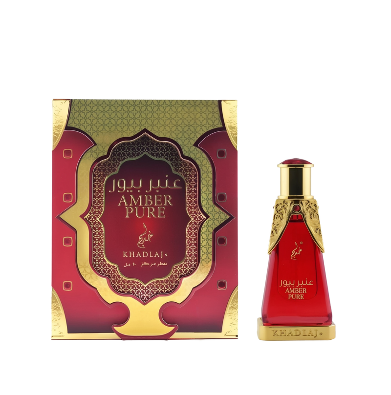 A red-and-gold rectangular box labeled 'Amber Pure' stands beside a matching red glass perfume bottle with ornate gold accents and 'Khadlaj' branding.