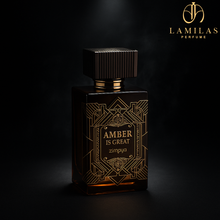 Zimaya Amber Is Great perfume bottle on dark background with gold highlights.