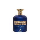 The bottle is a deep cobalt blue with a smooth, rounded shape. It has a metallic gold label with the name "AMBERLEY" embossed in the center. Below the main label, in elegant script, is the name "Ombre Blue." A small, gold stag emblem is placed at the bottom center of the bottle, indicating the logo for "MAISON ALHAMBRA." The cap of the bottle is gold with a textured design, resembling a crown or cog. 