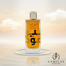 Lattafa Ameer Al Oudh Intense Oud perfume bottle with gold lettering and bold Arabic script, reflected in rippling water under a warm sky.lattafa-ameer-al-oudh-intense-oud-perfume-bottle.jpg