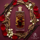 Ameer Al Oudh Intense Oud Lattafa bottle surrounded by oud chips, vanilla beans, jasmine flowers, and red rose petals.