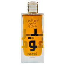 Lattafa Ameer Al Oudh Intense Oud perfume bottle featuring an amber liquid, gold cap, and large Arabic lettering.