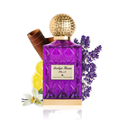 The image depicts a vibrant purple glass perfume bottle with a textured gold cap, labeled "Amethyst Khozam" in both Arabic and English script, suggesting the fragrance's name by the brand Ibraheem Al Qurashi. The bottle has a faceted design, reminiscent of cut amethyst gemstones. Accompanying the bottle are elements that hint at the scent's composition: a bundle of cinnamon sticks to the left, a slice of lemon in front, a white orchid flower at the bottom, and sprigs of lavender to the right.