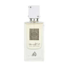 A clear rectangular bottle of Ana Abiyedh Eau de Parfum by Ard Al Zaafaran Lattafa Perfumes. The bottle features a minimalist design with a white cap adorned with small silver accents. The front of the bottle displays intricate silver patterns along with the fragrance name "Ana Abiyedh" in both Arabic and English.