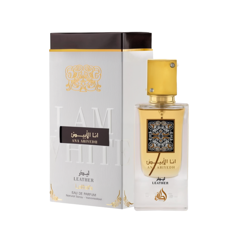 A perfume box and bottle set for 'Ana Abiyedh Leather' by Lattafa. The box is white with gold and black accents, featuring Arabic and English text that reads 'I Am White' in embossed letters. The bottle is clear with a gold label and a square gold cap ado