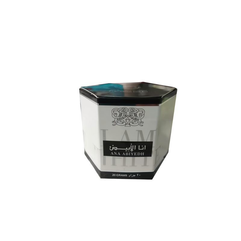 The image shows a hexagonal-shaped cream box from Ard Al Zaafaran. The box is primarily white with a black top. The center of the box features Arabic calligraphy in black, and below that, in English, it says "ANA ABIYEDH." At the bottom of the box, "20 GRAMS" is printed in a smaller font. The box has a turquoise-colored design along the top edge. There's a small, faded graphic and text on the left side of the box that appears to be part of the product branding.