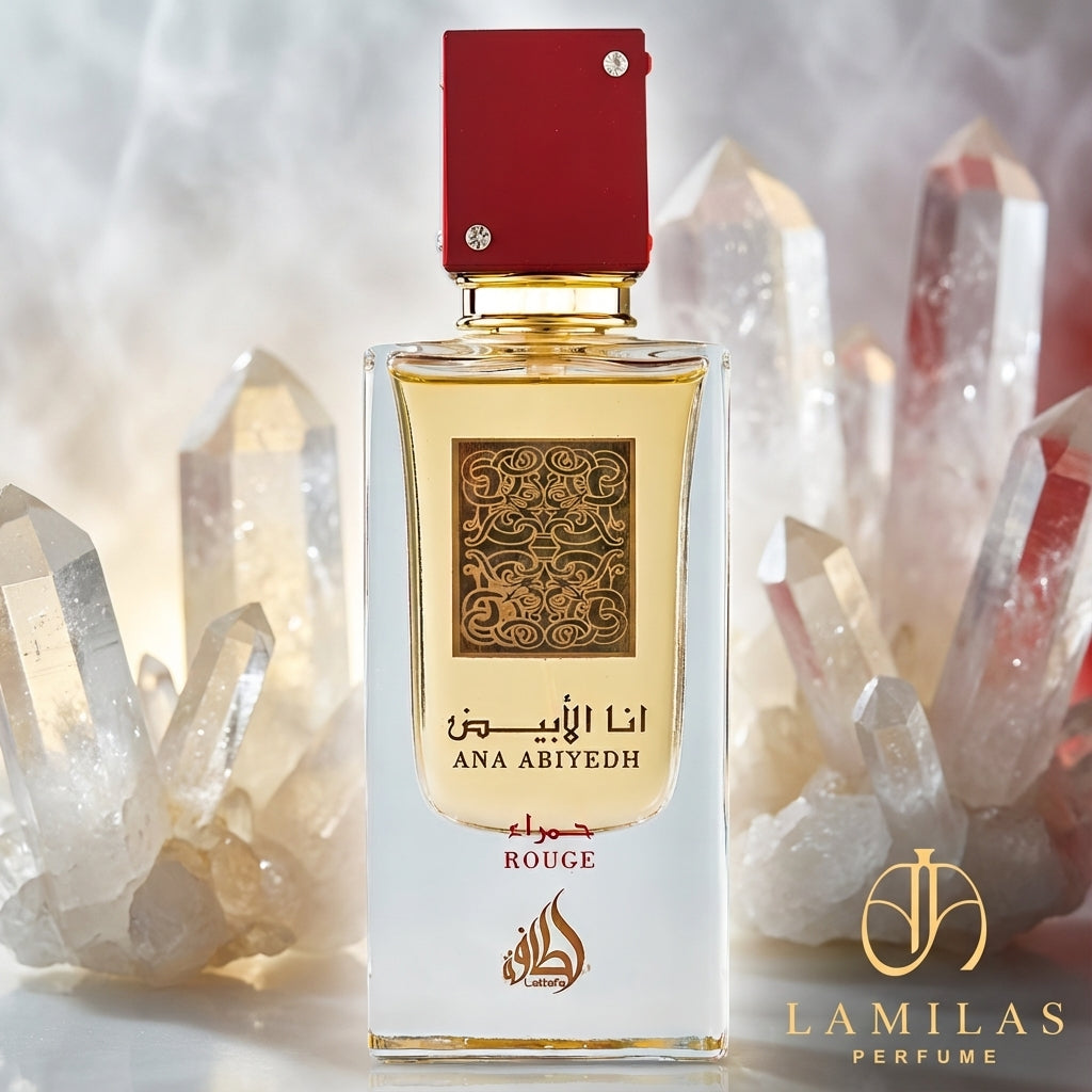 Lattafa Ana Abiyedh Rouge perfume bottle featuring a red cap, centered among clear quartz crystals.