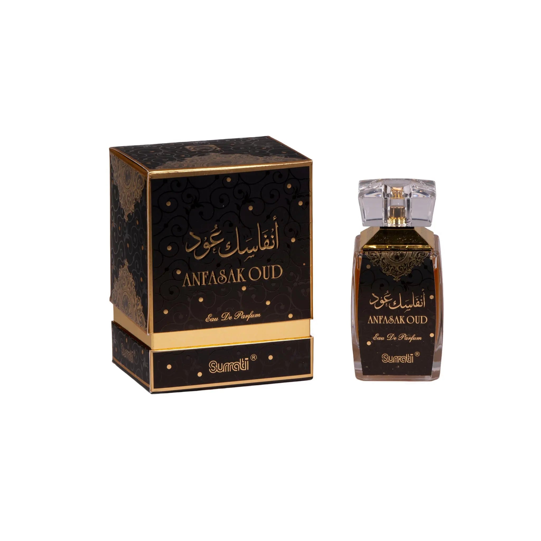 The image features a perfume bottle and its box. The box is black with a luxurious gold pattern, and the text "ANFASAK OUD Eau De Parfum" is written in both Arabic and English in a prominent gold font, indicating "I miss you Oud" or "Your Oud Fragrance." The bottle has a similar design with a clear glass body, dark liquid, and a label that matches the box's design. The cap of the bottle is transparent, and both the bottle and the box bear the brand name "Surrati."