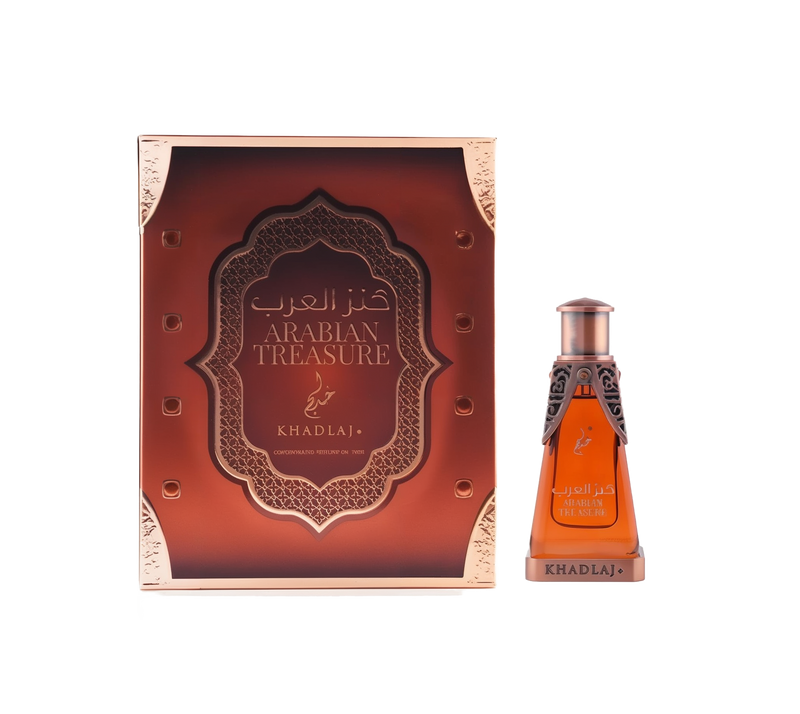 A rectangular copper-toned box labeled 'Arabian Treasure' next to a matching amber-colored glass perfume bottle with ornate metallic detailing and 'Khadlaj' branding.