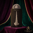 Lattafa Art of Arabia I perfume packaging; black box adorned with a silver relief of the Burj Khalifa on purple velvet.
