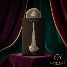 Lattafa Art of Arabia I perfume packaging; black box adorned with a silver relief of the Burj Khalifa on purple velvet.