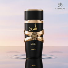 Matte black Lattafa Asad perfume bottle featuring gold trim and Arabic calligraphy, reflected in water.lattafa-asad-perfume-black-gold-bottle.jpg