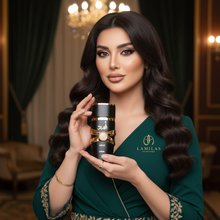 Elegant woman in a green gown holds the black and gold Lattafa Asad perfume bottle.